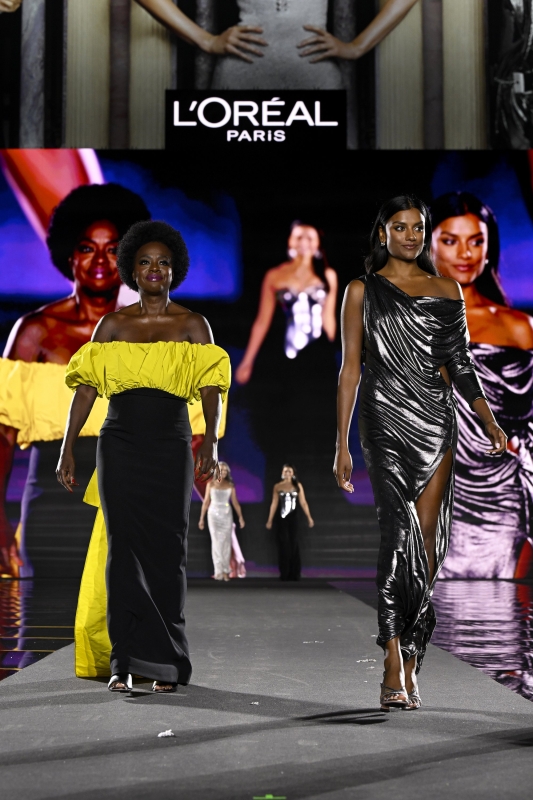 Simone Ashley and Viola Davis walk the runway of the Walk Your Worth show, hosted by L'Oréal Paris, on September 23, 2024 in Paris, France
