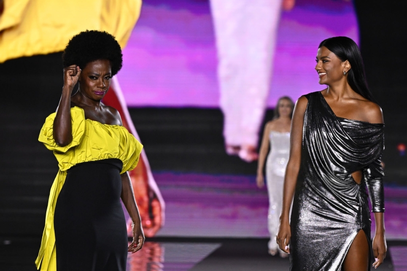 Simone Ashley and Viola Davis walk the runway of the Walk Your Worth show, hosted by L'Oréal Paris, on September 23, 2024 in Paris, France
